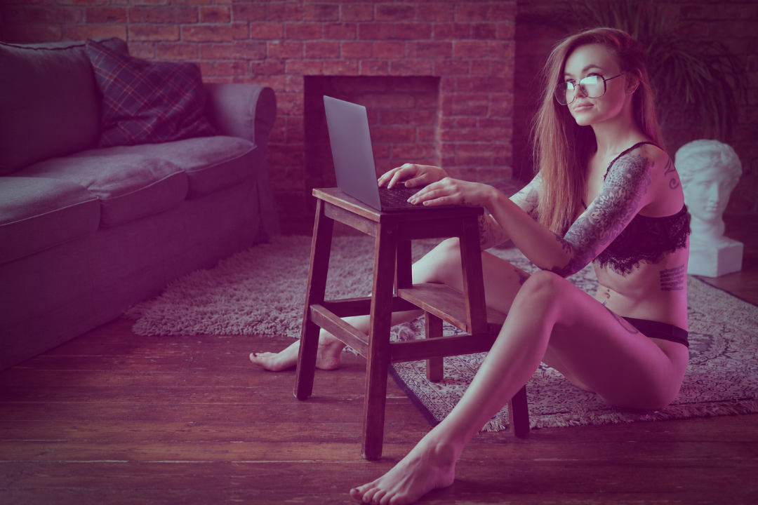 Content creator setting up a Fansly account and managing her creator business from home